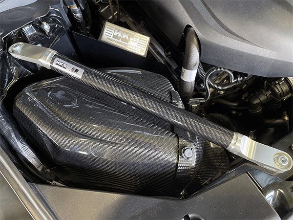 HKS Carbon Brace clear anodized bracket with HKS logo GR Supra